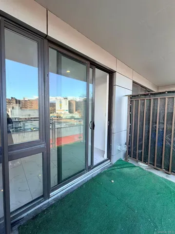 a view of outdoor space with sliding door and wooden floor