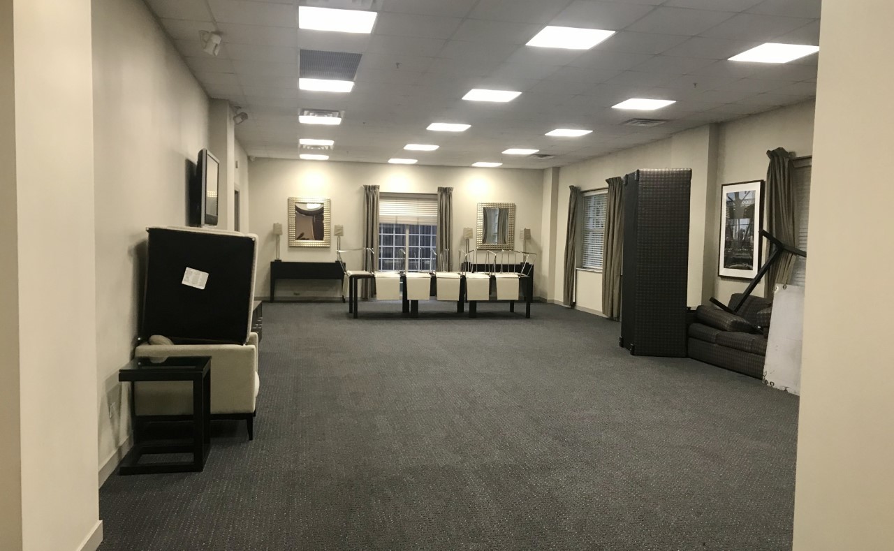 21 West Chestnut Street, Unit 1708 Chicago, IL 60610 - Photo 6 of 6 a living room with furniture and a chandelier