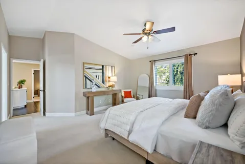 a bedroom with a bed and window
