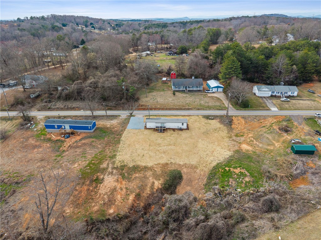 139 Davis Road Easley, SC 29640 - Photo 27 of 34 An aerial view showcases vast undeveloped land, promising endless possibilities for expansion.