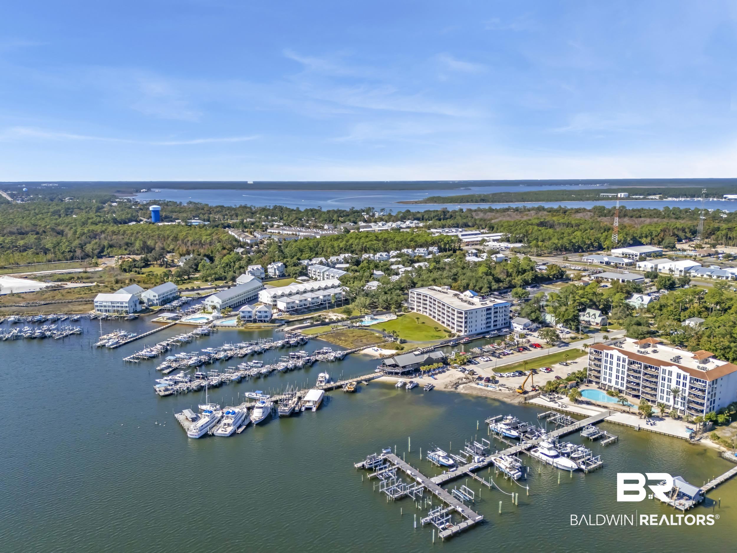 27282 Canal Road, Unit 104 Orange Beach, AL 36561 - Photo 55 of 79 Aerial view of a marina and a large body of water