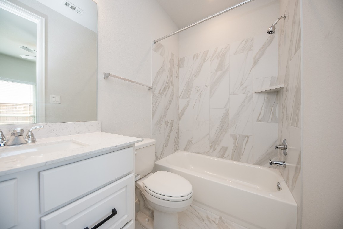 29819 Breezy Pnes Loop Fulshear, TX 77441 - Photo 13 of 50 a bathroom with a sink toilet and shower