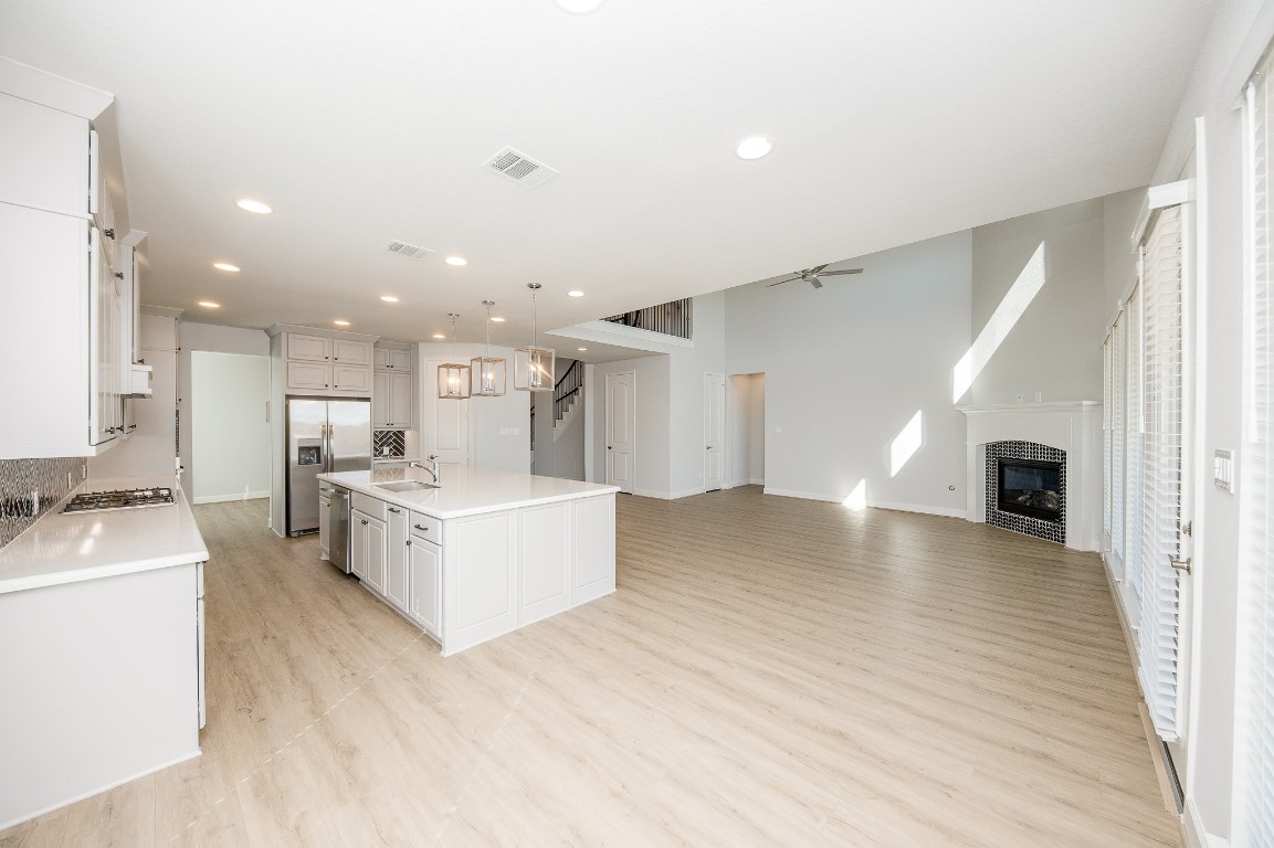 29819 Breezy Pnes Loop Fulshear, TX 77441 - Photo 24 of 50 a view of kitchen with furniture and wooden floor