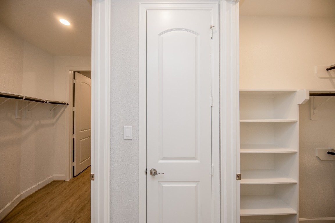 29819 Breezy Pnes Loop Fulshear, TX 77441 - Photo 39 of 50 a view of walk in closet with empty racks