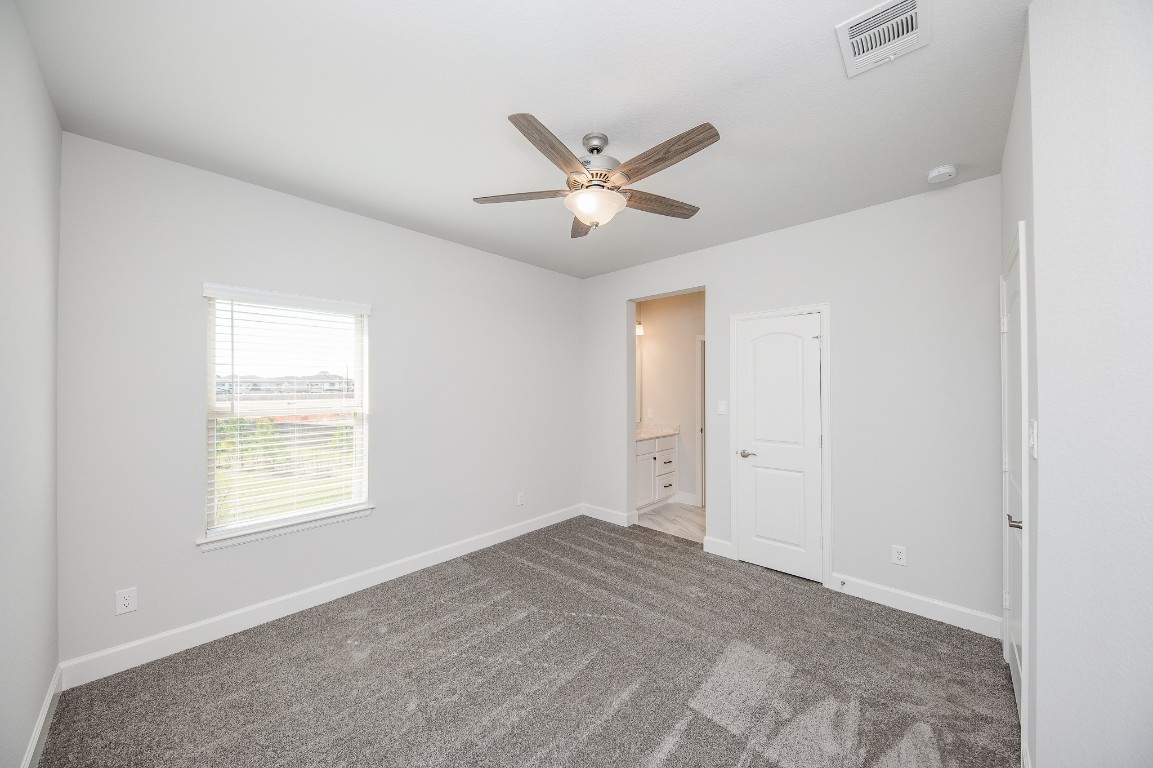 29819 Breezy Pnes Loop Fulshear, TX 77441 - Photo 43 of 50 a view of an empty room with a window