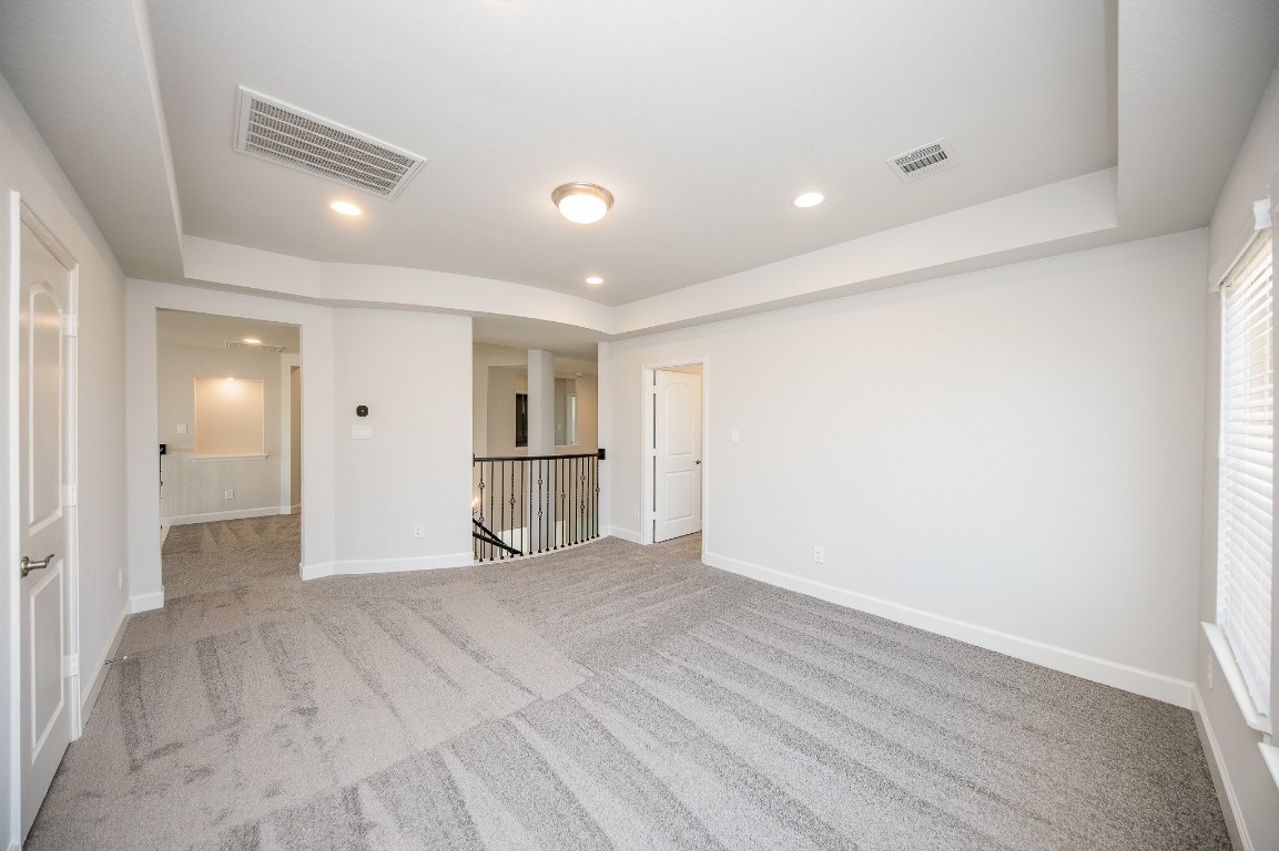 29819 Breezy Pnes Loop Fulshear, TX 77441 - Photo 49 of 50 a view of empty room with wooden floor