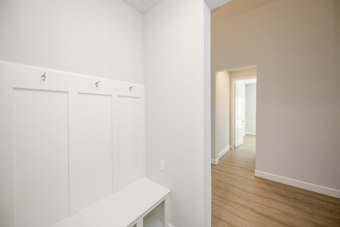 29819 Breezy Pnes Loop Fulshear, TX 77441 - Photo 10 of 50 a view of a room with wooden floor