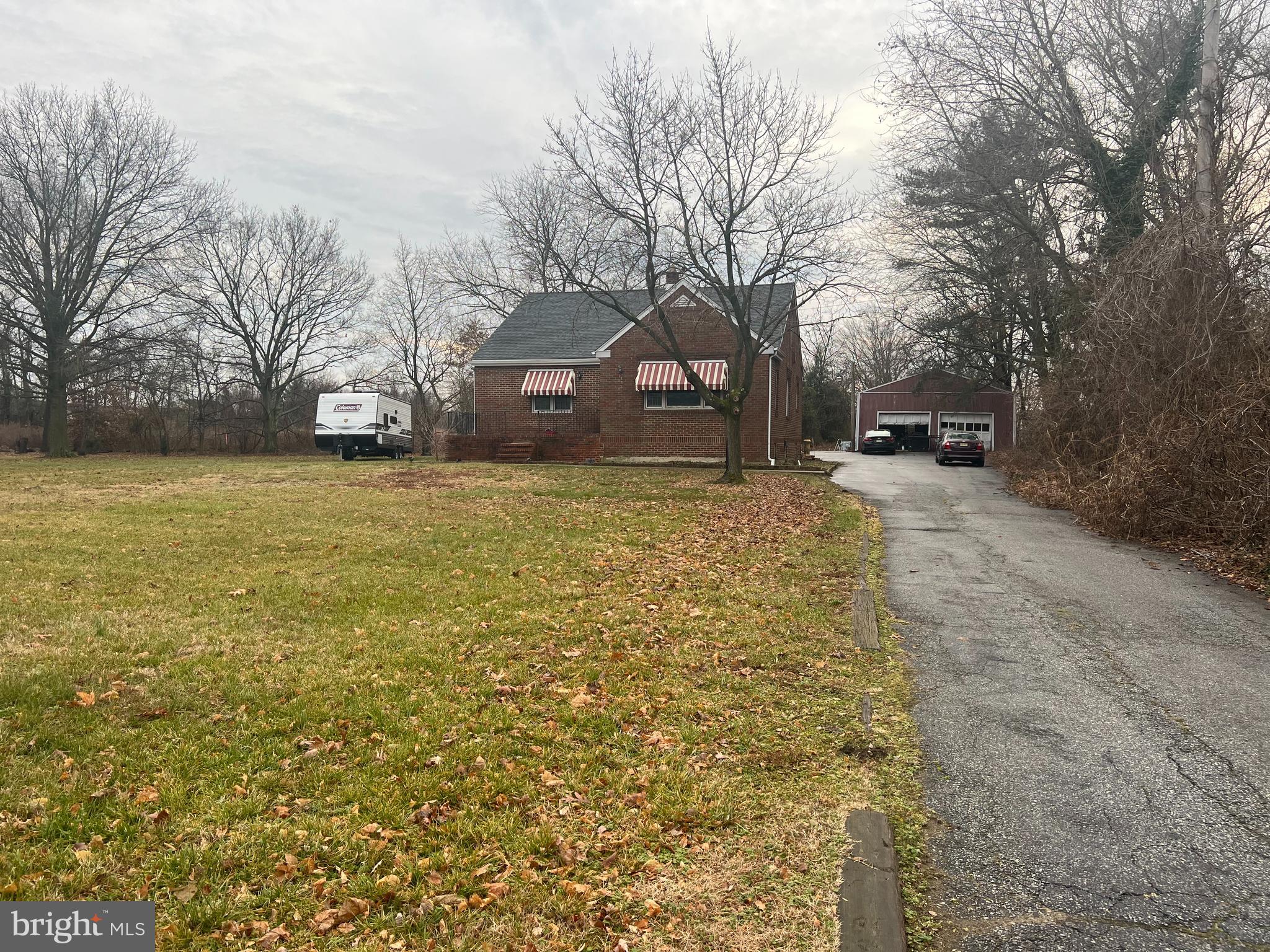 1604 High Hill Road Swedesboro, NJ 08085 - Photo 1 of 21 a front view of a house with a yard and trees