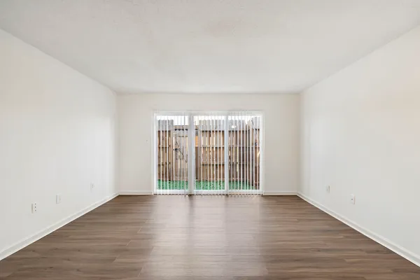 a view of wooden floor and chandelier in a room