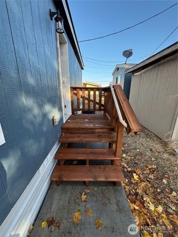 a view of balcony with wooden floor