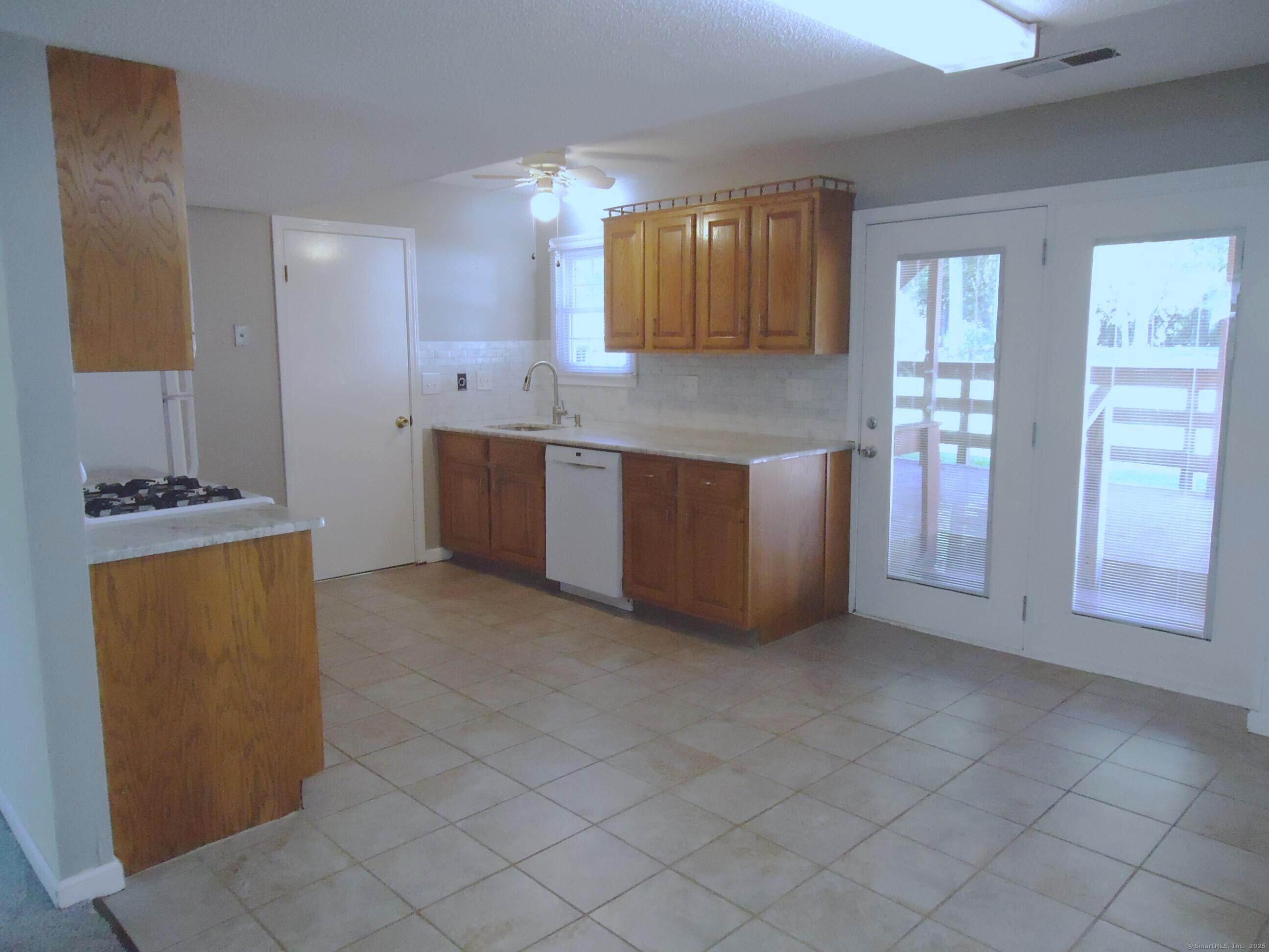 20 Fawn Ridge Drive North Haven, CT 06473 - Photo 18 of 27 a kitchen with stainless steel appliances granite countertop a refrigerator and a stove top oven