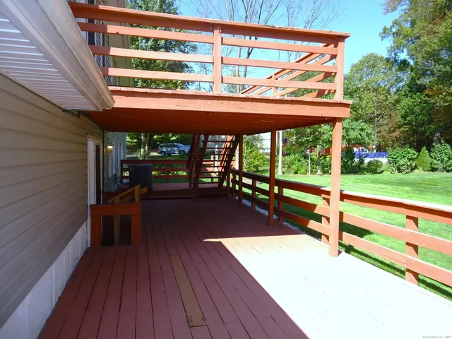 a view of a patio with wooden floor and roof