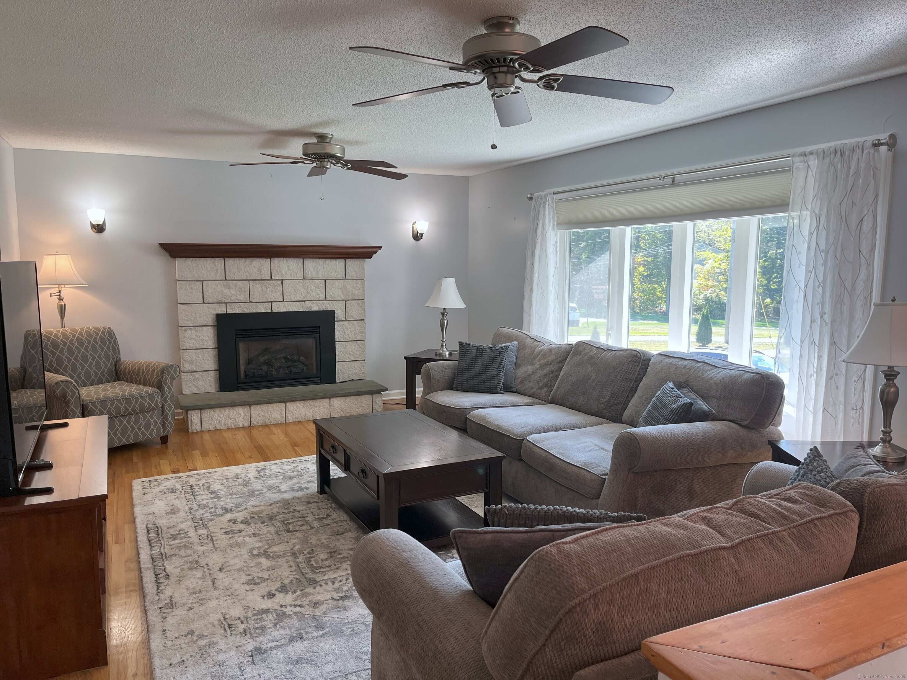 20 Fawn Ridge Drive North Haven, CT 06473 - Photo 4 of 27 a living room with furniture and a fireplace
