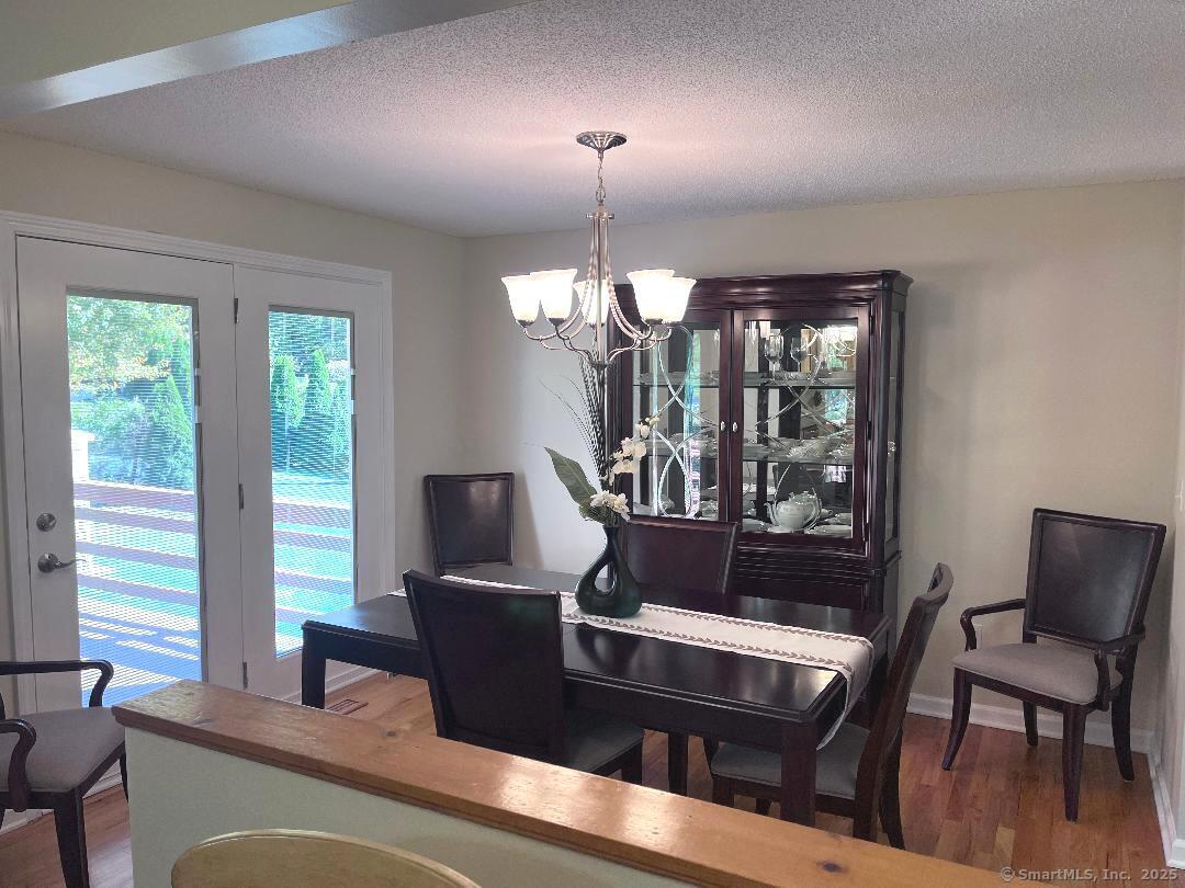 20 Fawn Ridge Drive North Haven, CT 06473 - Photo 9 of 27 a living room with furniture chandelier and a window