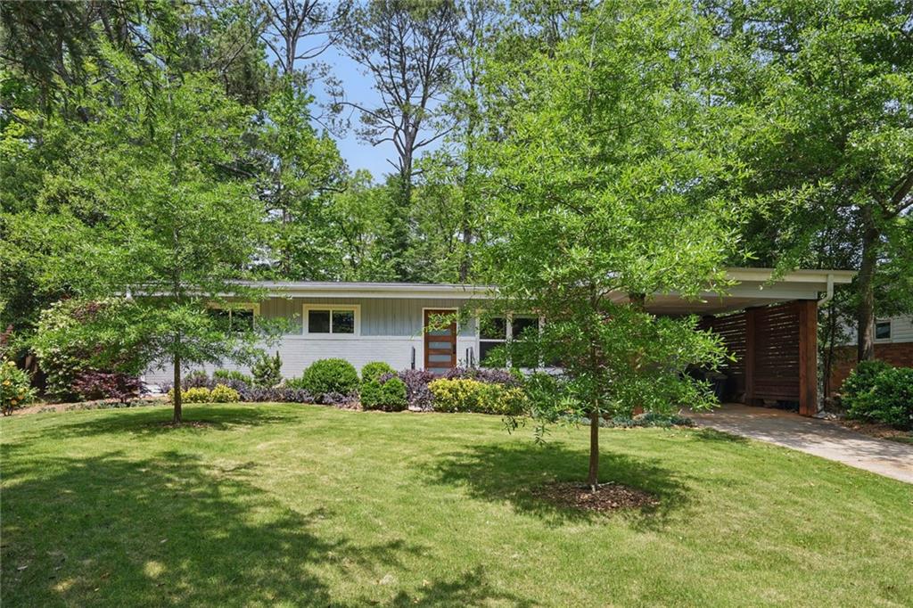 3018 Monterey Drive Decatur, GA 30032 - Photo 1 of 1 a view of a house with a yard and plants
