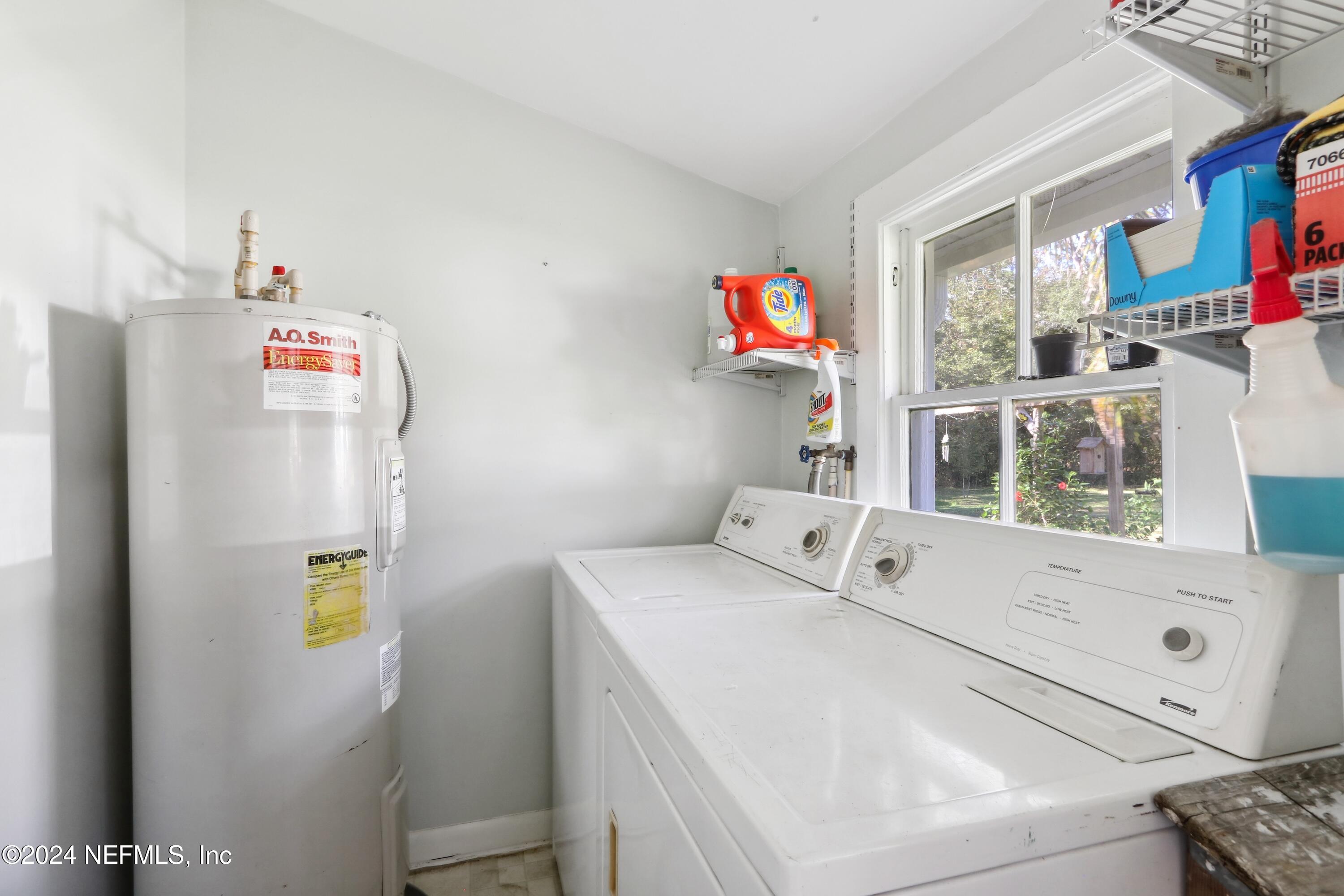 3629 Capper Road Jacksonville, FL 32218 - Photo 15 of 26 a utility room with dryer and washer