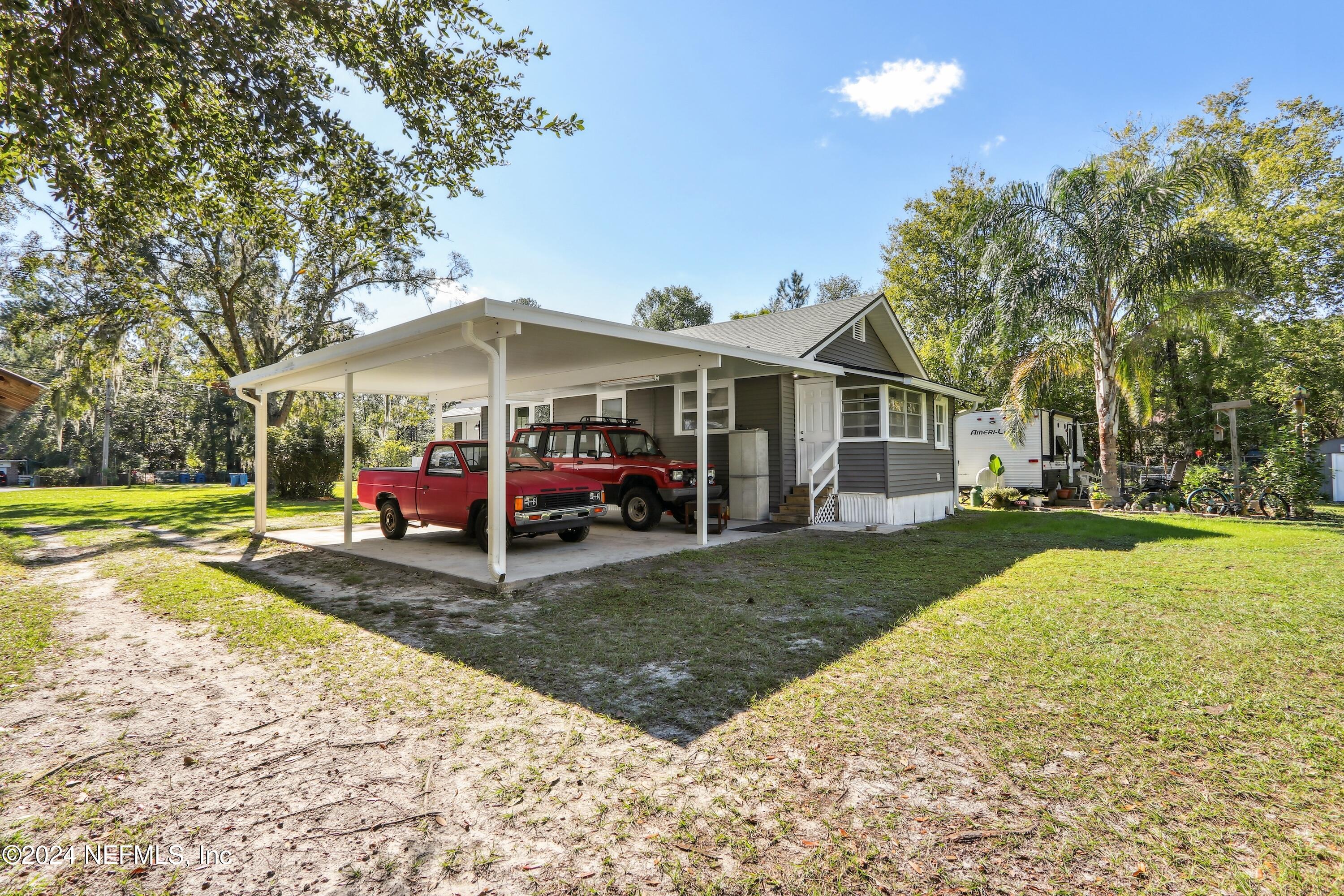 3629 Capper Road Jacksonville, FL 32218 - Photo 16 of 26 a view of a house with yard and sitting area