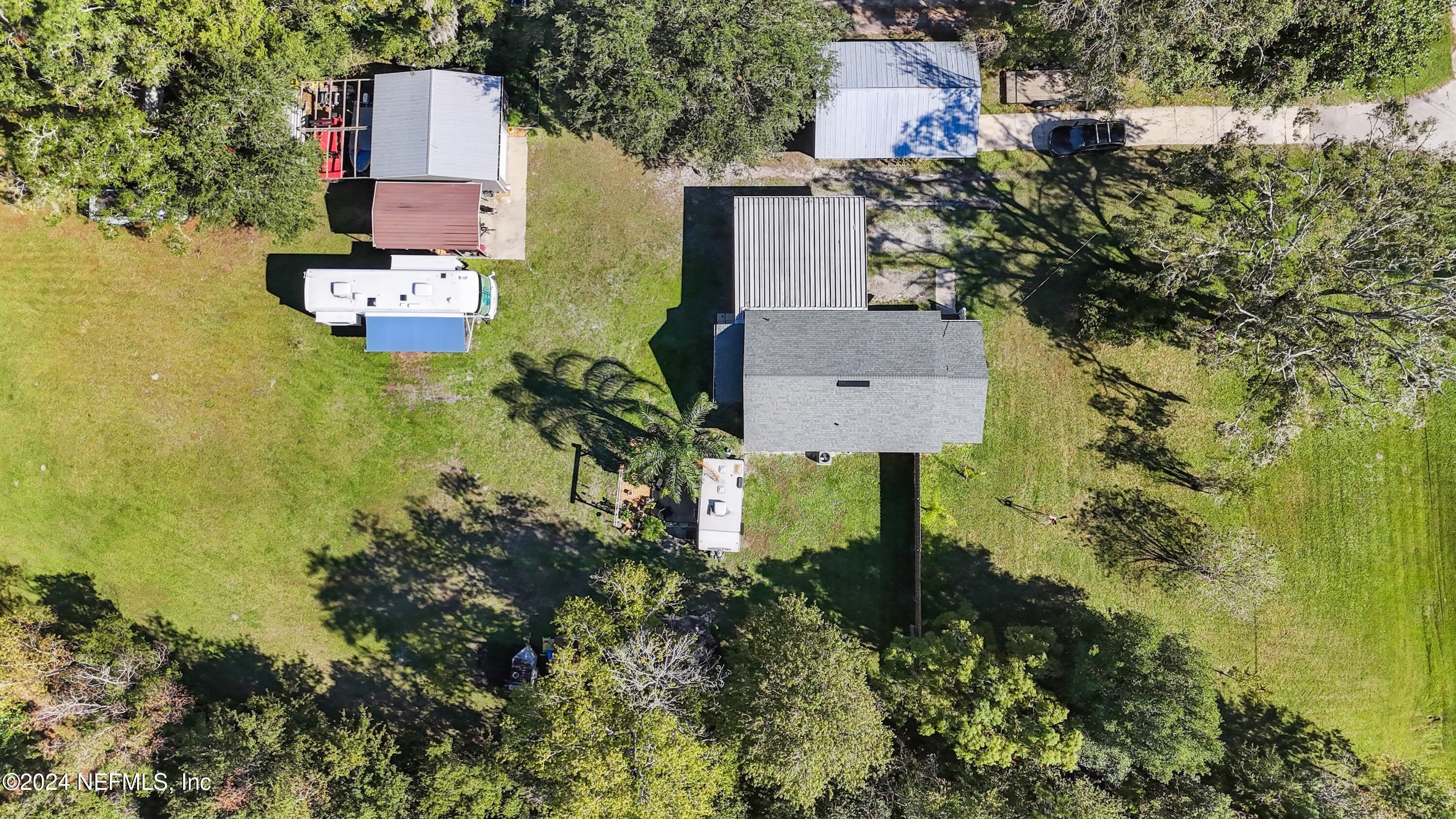 3629 Capper Road Jacksonville, FL 32218 - Photo 23 of 26 an aerial view of residential houses with outdoor space and trees