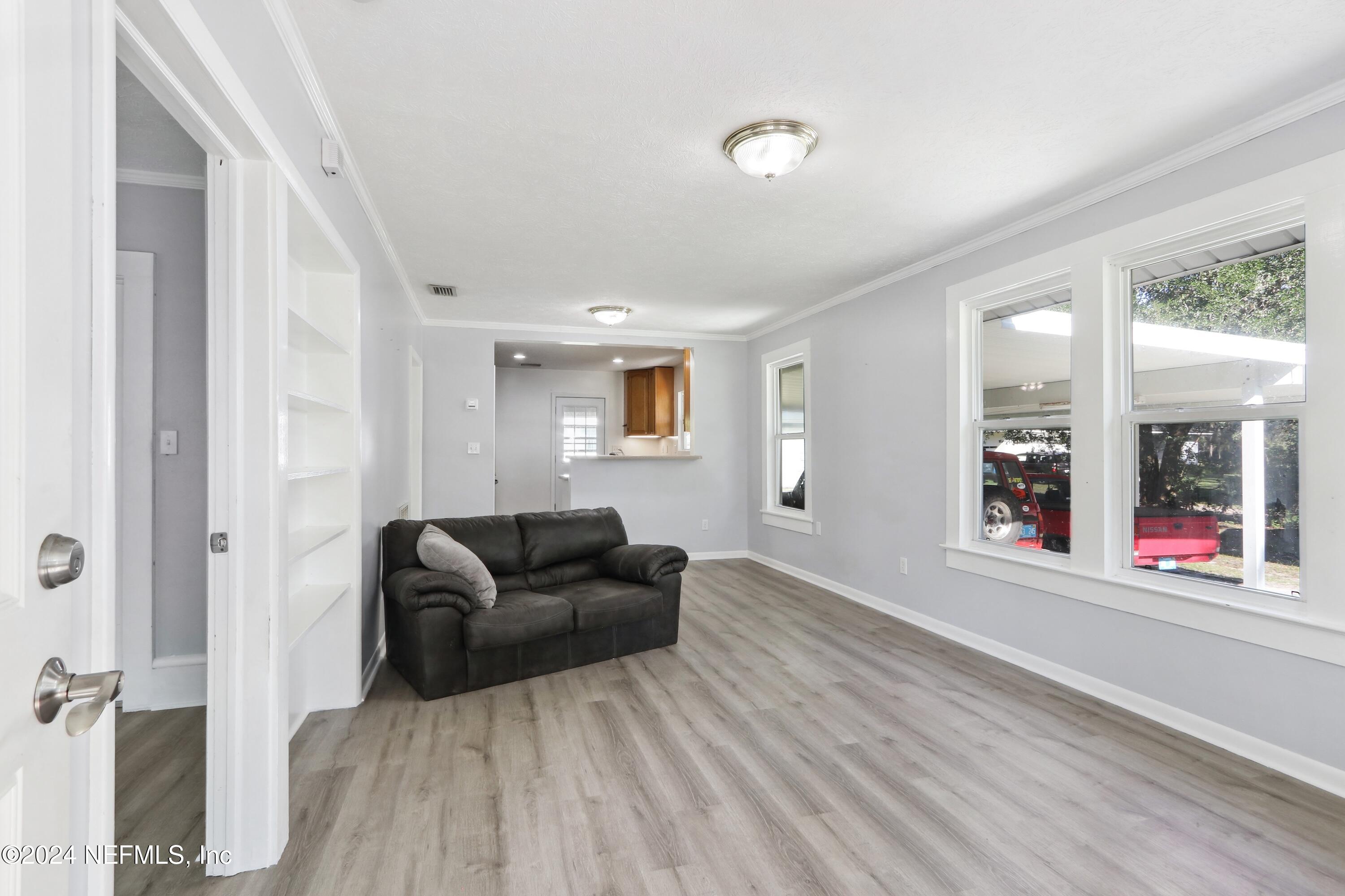 3629 Capper Road Jacksonville, FL 32218 - Photo 5 of 26 a living room with furniture and a window