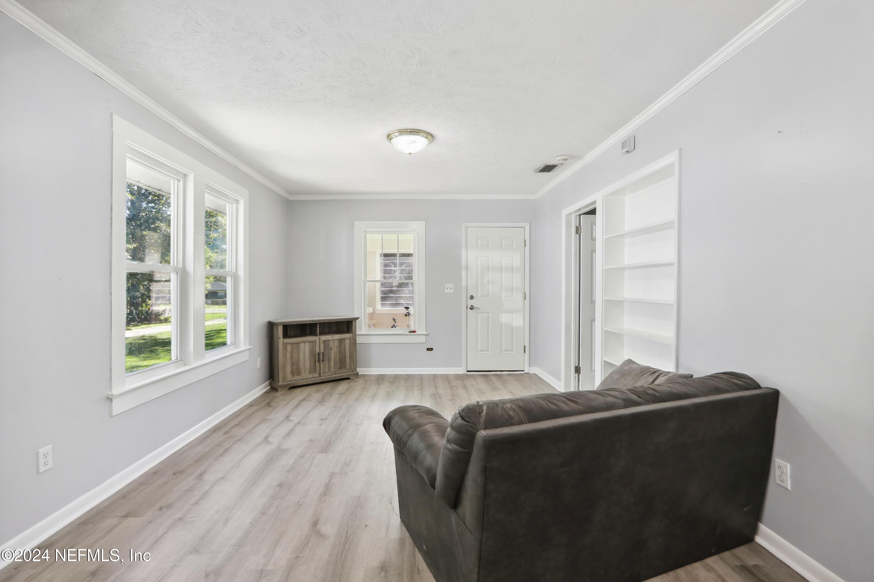 3629 Capper Road Jacksonville, FL 32218 - Photo 6 of 26 a living room with furniture and windows