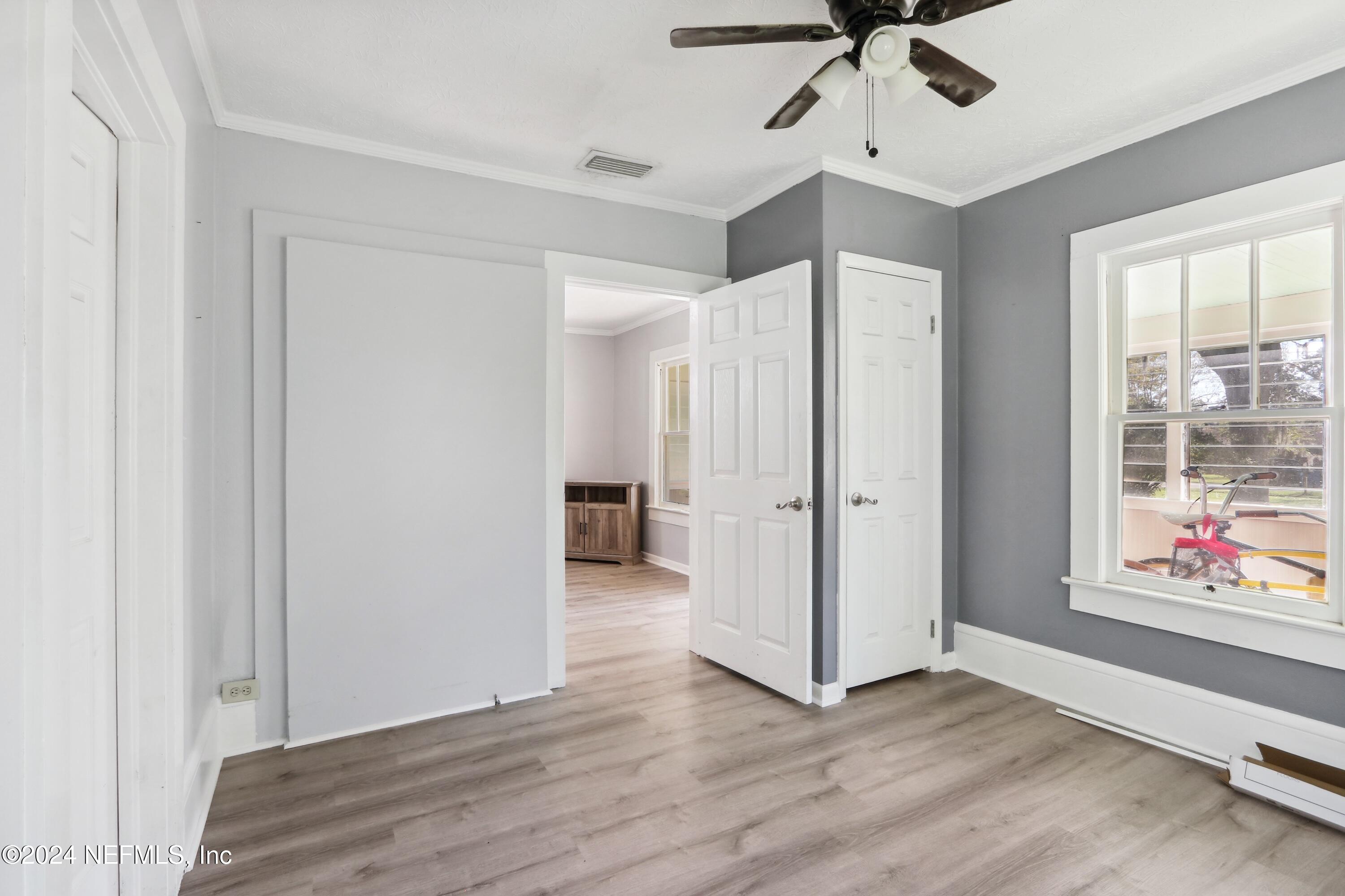 3629 Capper Road Jacksonville, FL 32218 - Photo 8 of 26 a view of an empty room and window