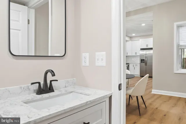 a bathroom with a sink and a mirror