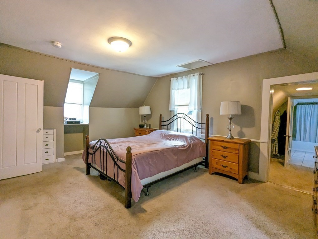 622 Turnpike Road New Ipswich, NH 03071 - Photo 23 of 30 a bedroom with a bed and a cabinets