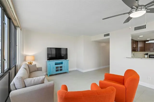 a kitchen with a sink a refrigerator and a stove