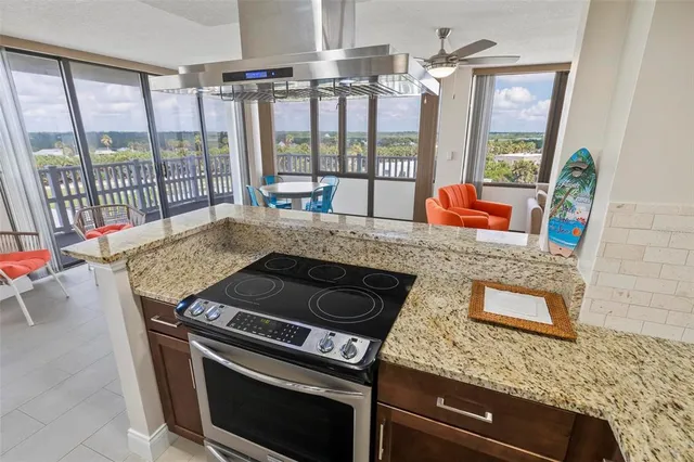 a room with a bed and a large window with bathroom view