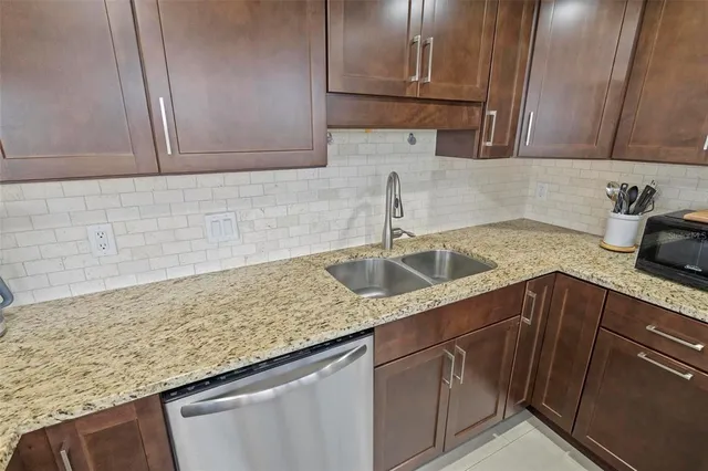 a bedroom with two beds and large window