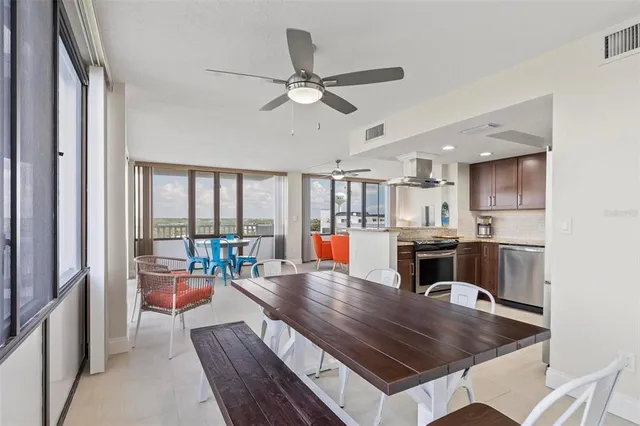 a bathroom with a granite countertop shower sink vanity mirror and toilet