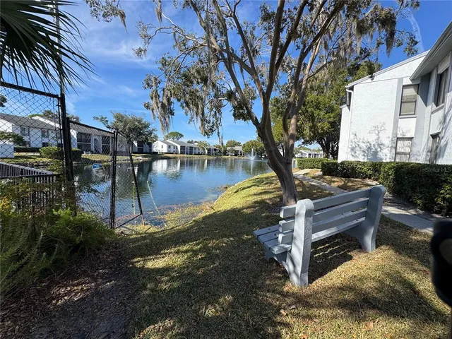 a view of a lake with sitting area