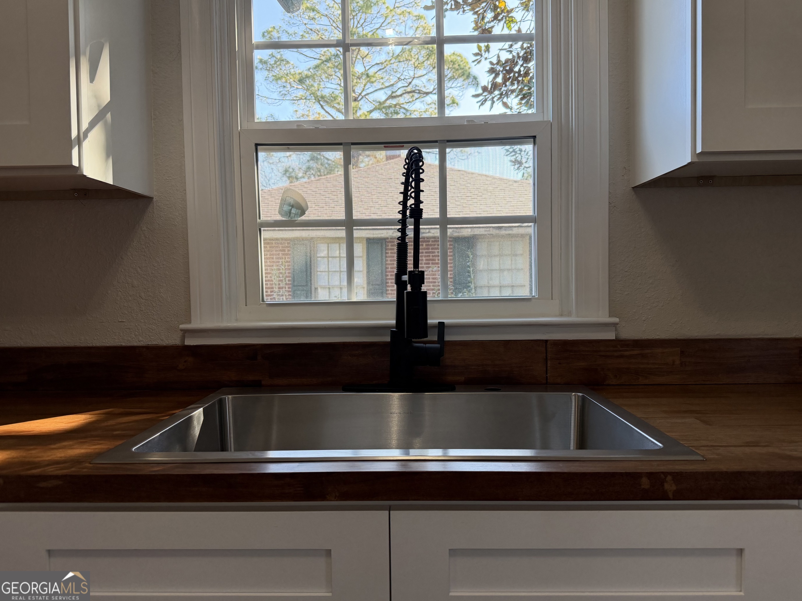 1502 Stonewall Street Dublin, GA 31021 - Photo 16 of 24 a view of a sink and a microwave