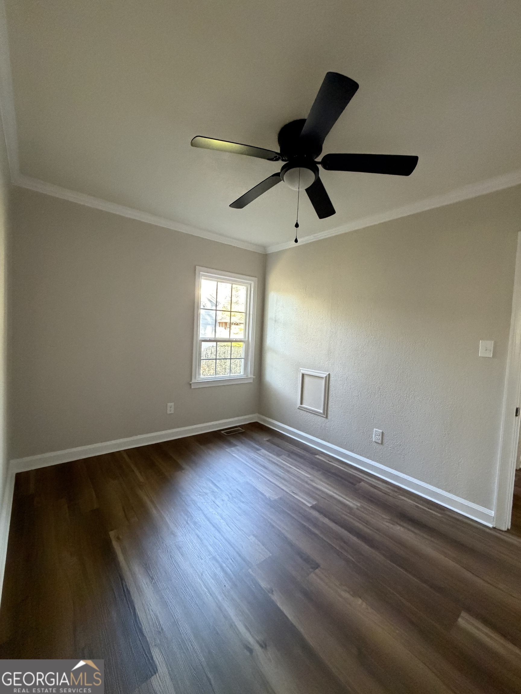 1502 Stonewall Street Dublin, GA 31021 - Photo 17 of 24 a view of room window and wooden floor