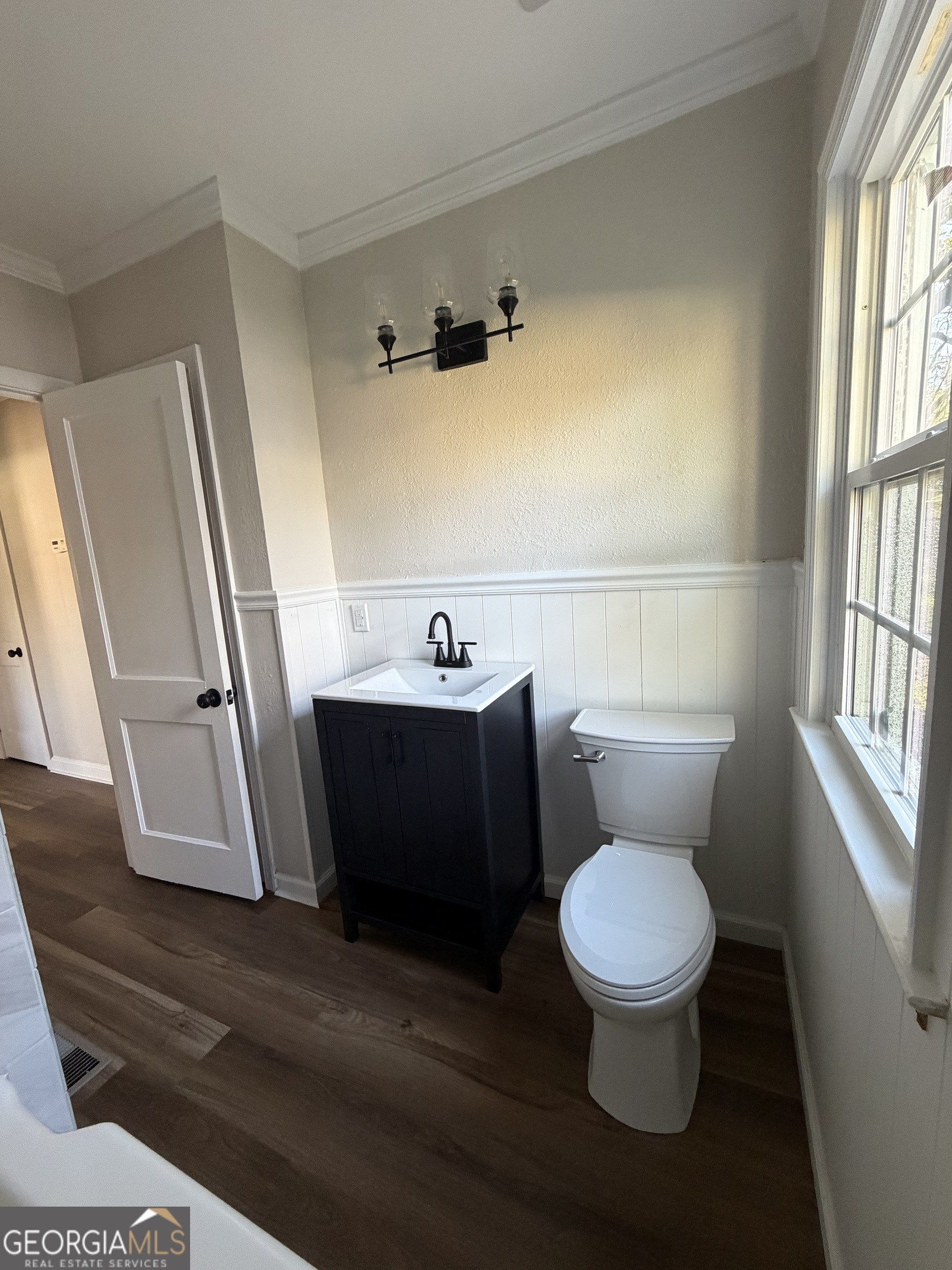 1502 Stonewall Street Dublin, GA 31021 - Photo 22 of 24 a bathroom with a toilet and a sink