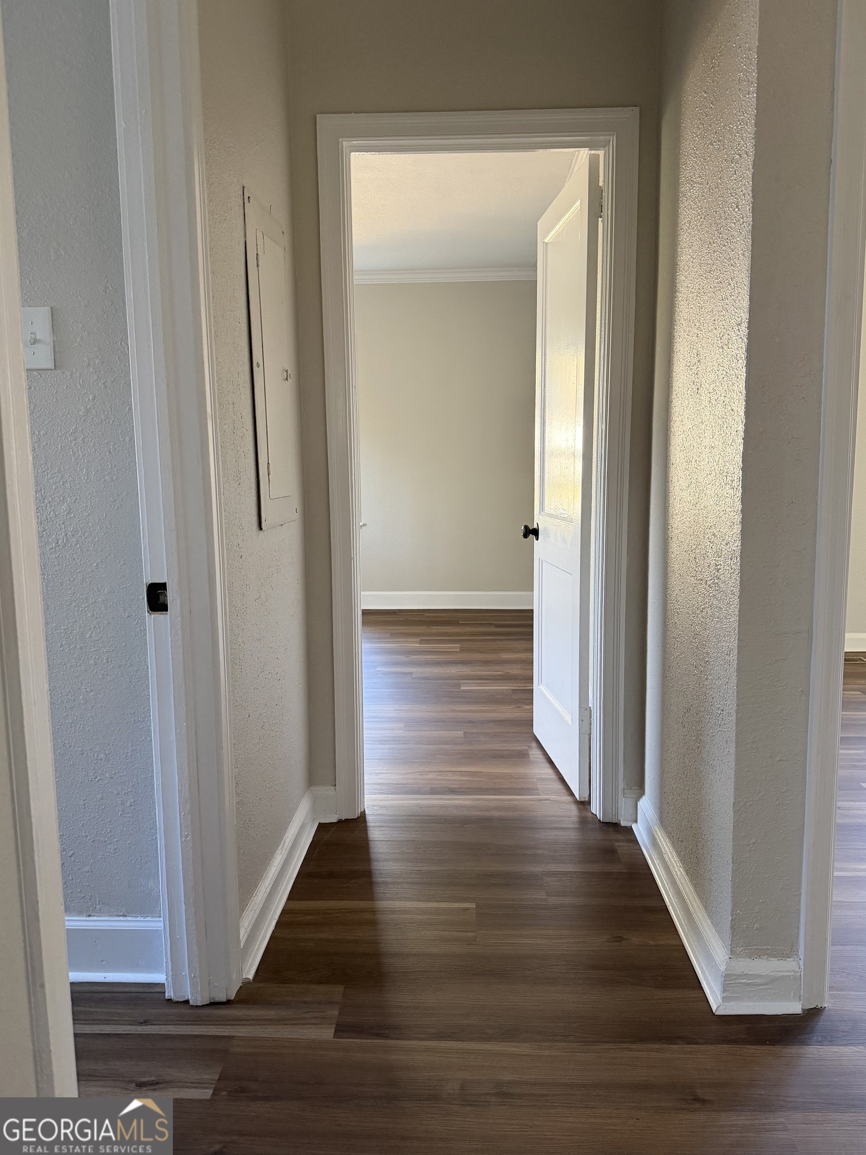 1502 Stonewall Street Dublin, GA 31021 - Photo 23 of 24 a view of a hallway with wooden floor
