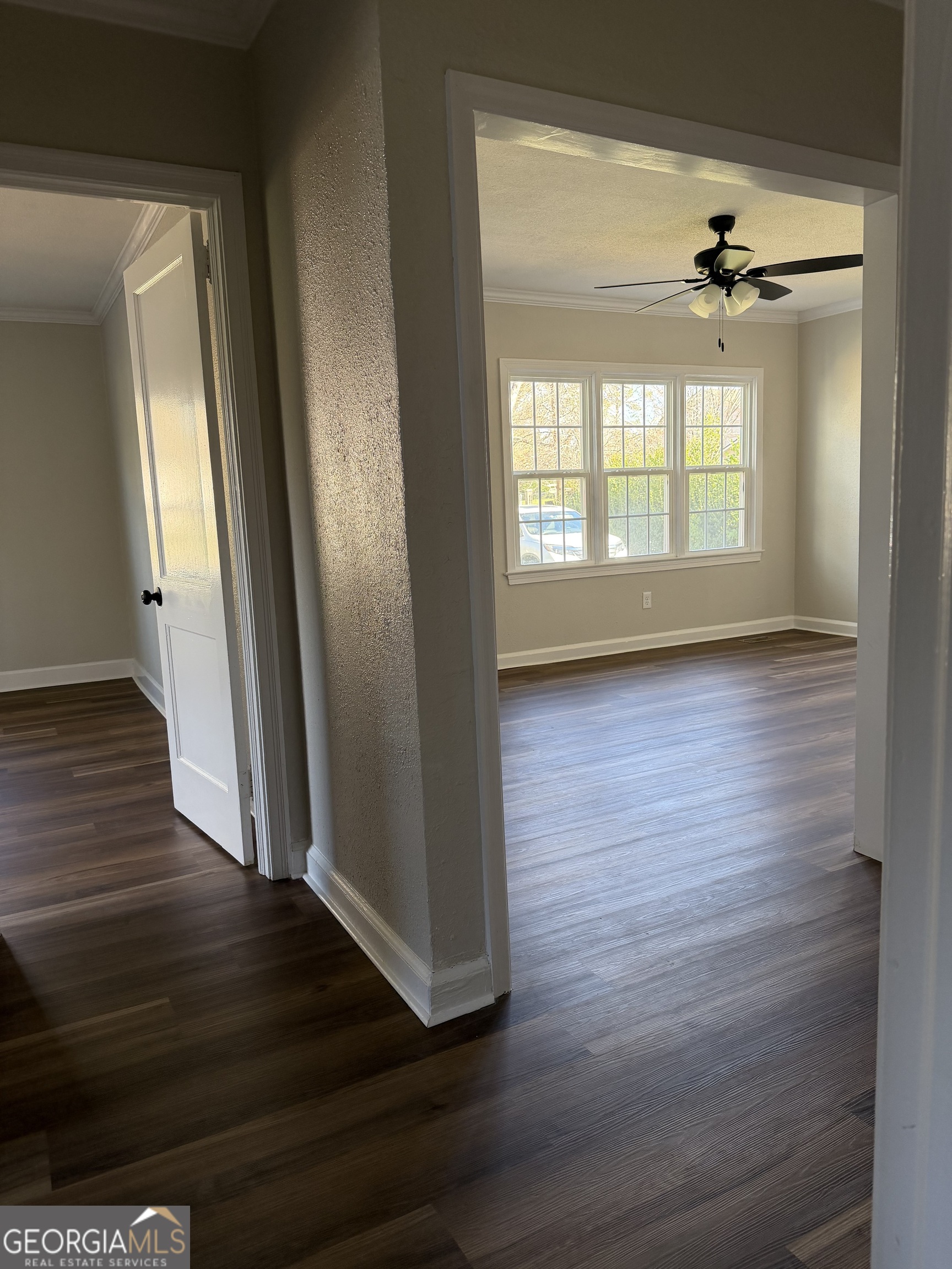 1502 Stonewall Street Dublin, GA 31021 - Photo 24 of 24 wooden floor in an empty room with a window