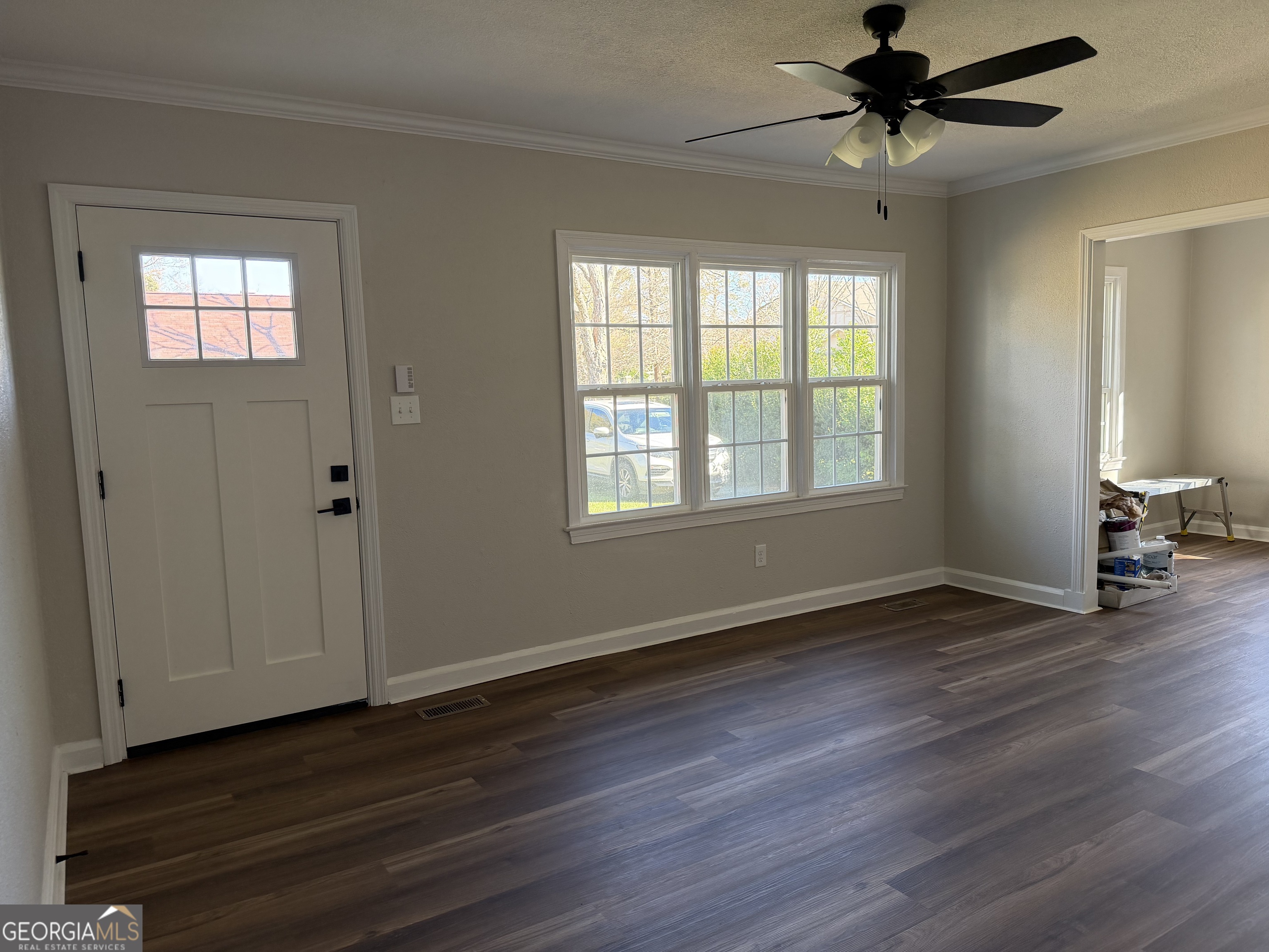 1502 Stonewall Street Dublin, GA 31021 - Photo 6 of 24 a view of an empty room with wooden floor and a window