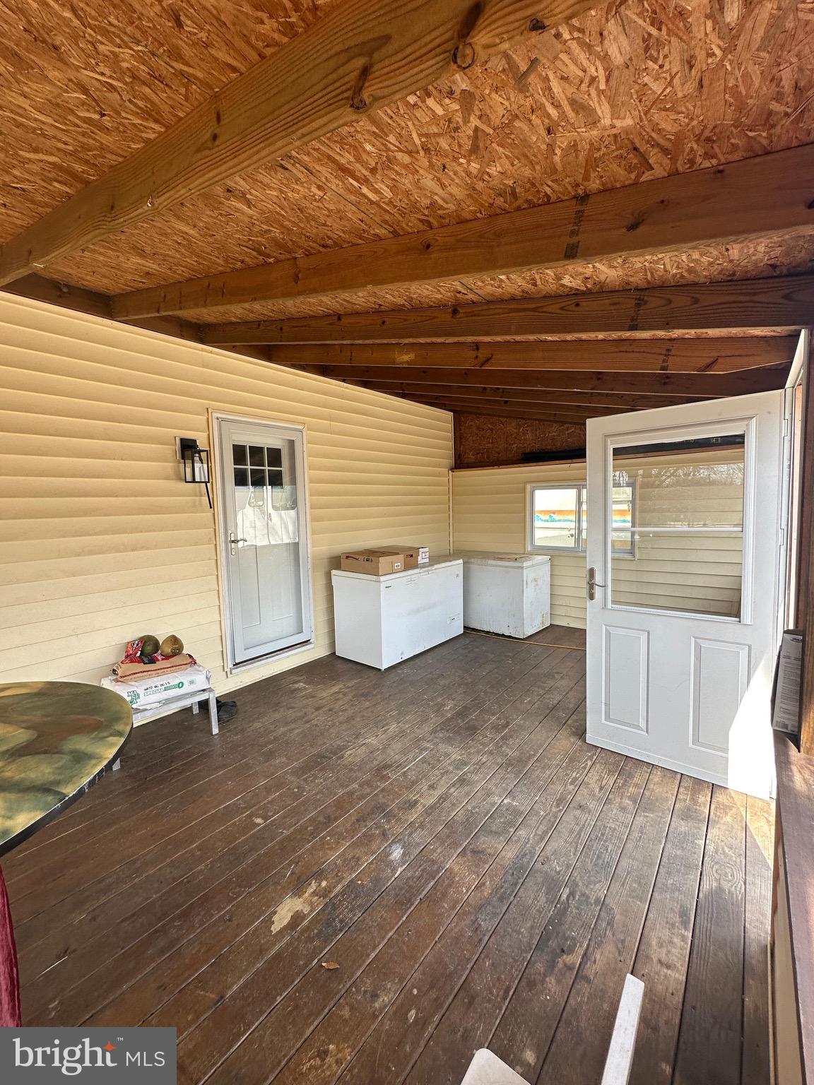 4427 Annapolis Road Halethorpe, MD 21227 - Photo 4 of 36 a view of a porch with wooden floor