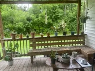 a view of a balcony with chairs