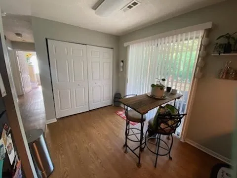 a dining room with furniture and window