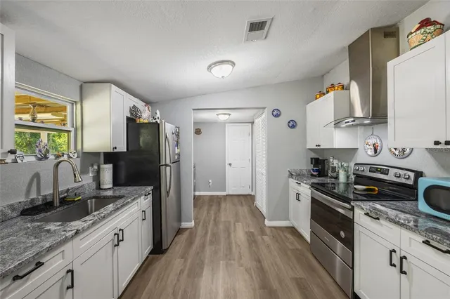 a bathroom with a sink mirror and toilet