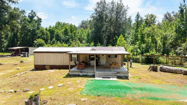 a view of a room with gym equipment and a large window