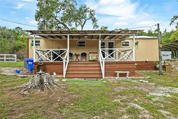 a backyard of a house with lots of green space
