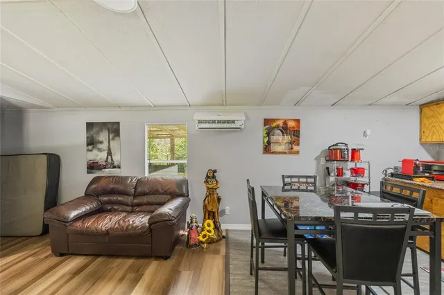 an aerial view of a house with a yard and garden