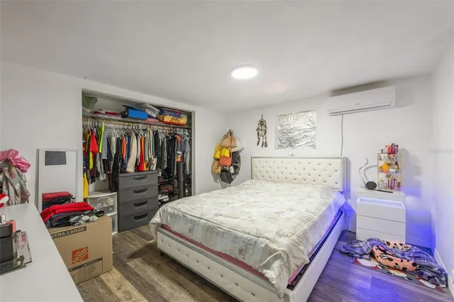 an aerial view of a house with a yard and large trees