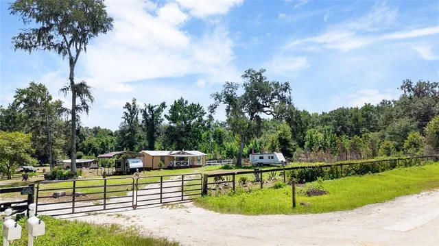 a house view with a sitting space and a swimming pool
