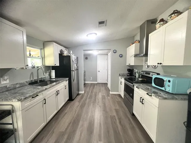 a large kitchen with a lot of counter space