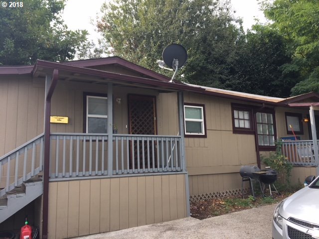 4840 Northeast 99th Avenue Portland, OR 97220 - Photo 2 of 6 a side view of a house with a yard