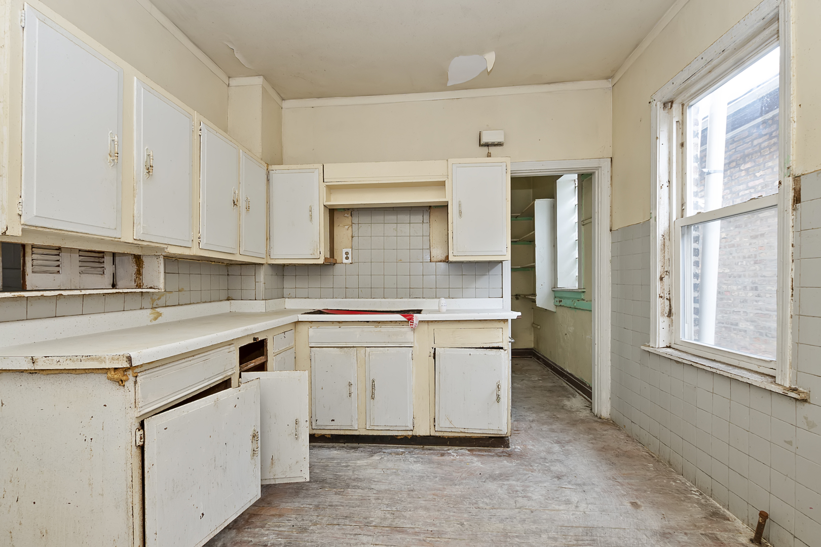 4821 West Hirsch Street Chicago, IL 60651 - Photo 14 of 23 a kitchen with granite countertop a sink and a stove top oven